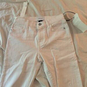 White skinny jeans with rips in knees